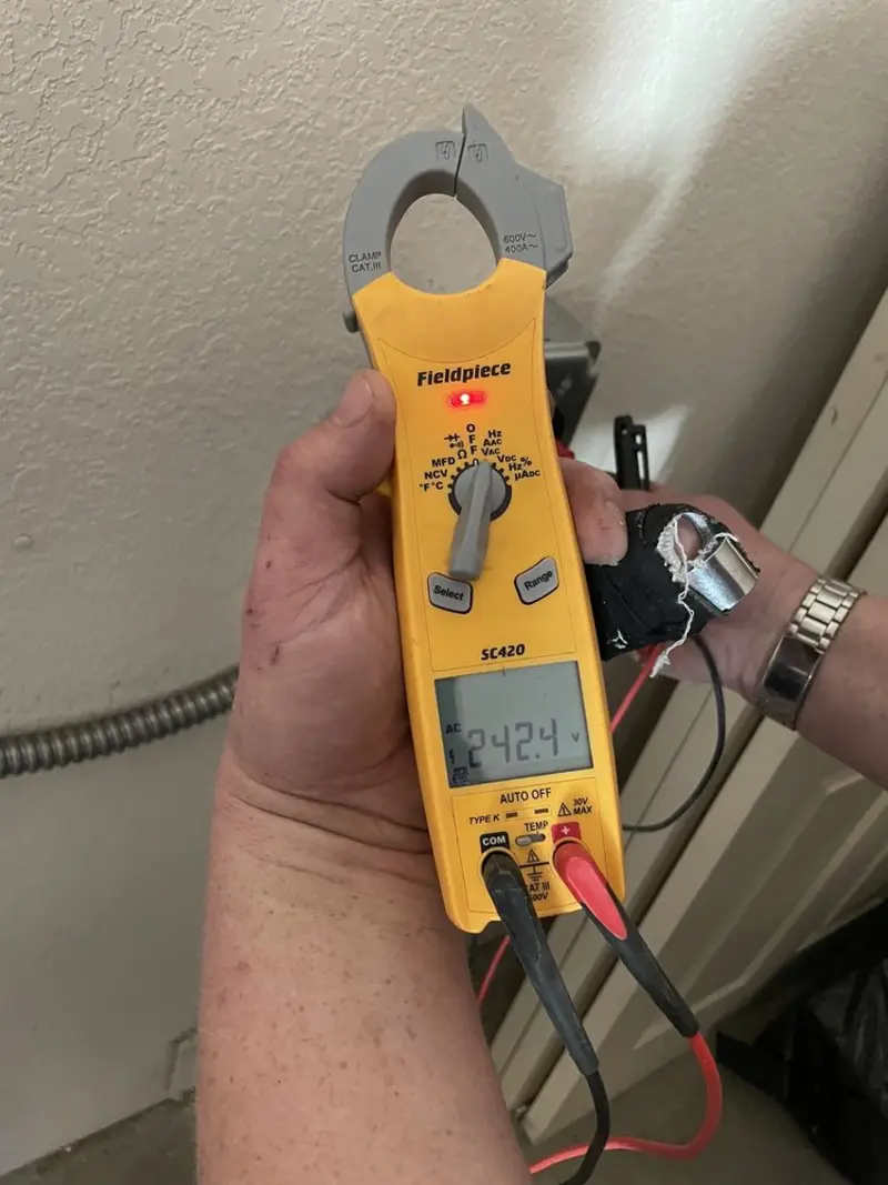 Voltage testing with clamp meter during Hot Tub / Pool Electrical Wiring in Goddard